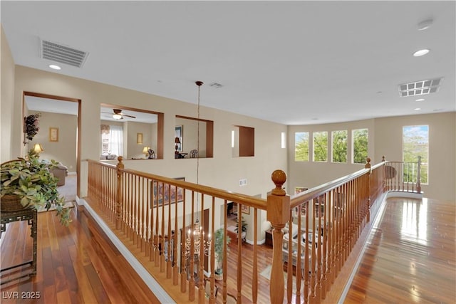9614 Stonily Ln, Las Vegas, NV 89178 - hall featuring plenty of natural light, an upstairs landing, wood-type flooring, and recessed lighting