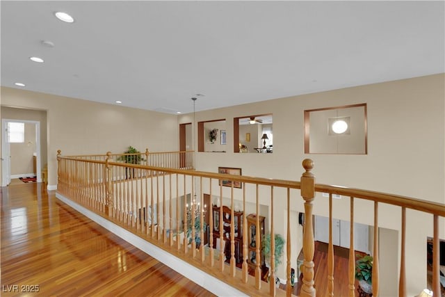 9614 Stonily Ln, Las Vegas, NV 89178 - corridor featuring wood finished floors, an upstairs landing, recessed lighting, and baseboards