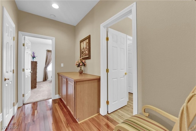 9614 Stonily Ln, Las Vegas, NV 89178 - hallway featuring light wood finished floors and baseboards