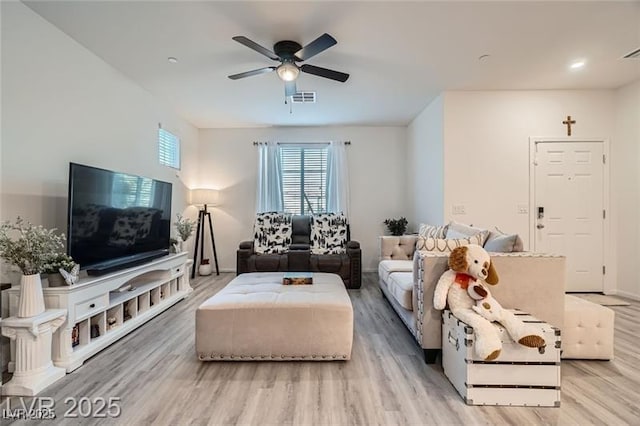 1328 Graphite Ave, Henderson, NV 89002 - living room featuring light wood-type flooring, ceiling fan, and baseboards