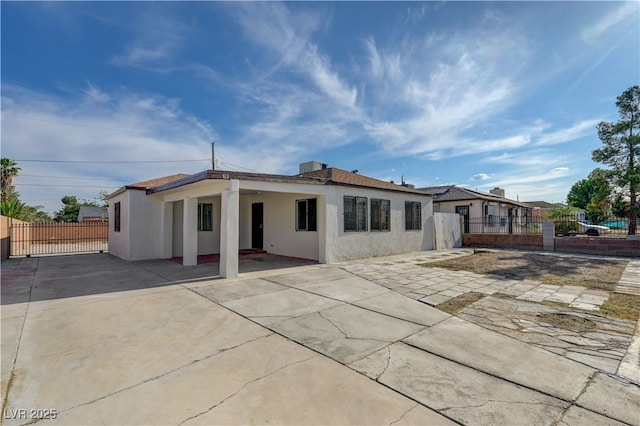 813 E Bartlett Ave, North Las Vegas, NV 89030 - back of house featuring stucco siding and a patio