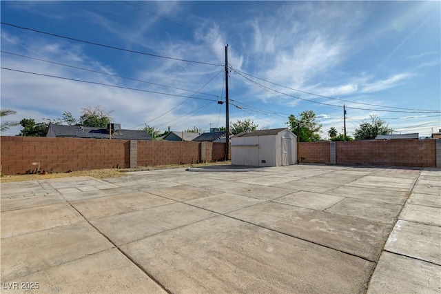 813 E Bartlett Ave, North Las Vegas, NV 89030 - fenced backyard with a storage shed and a patio area