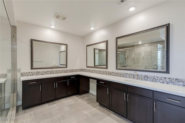 11280 Granite Ridge Dr Unit 1009, Las Vegas, NV 89135 - bathroom featuring vanity, a shower stall, decorative backsplash, and recessed lighting