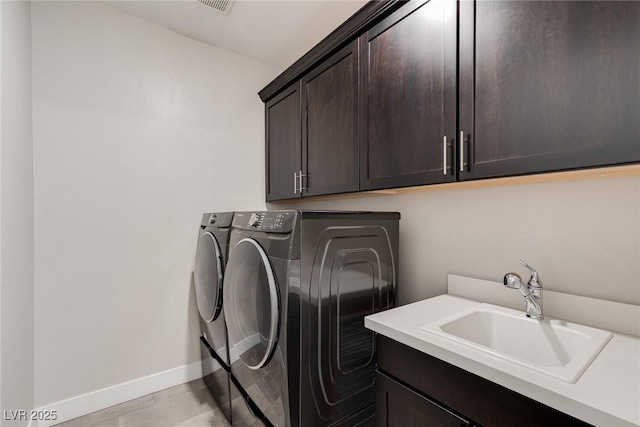 11280 Granite Ridge Dr Unit 1009, Las Vegas, NV 89135 - washroom with cabinet space, washer and dryer, and baseboards