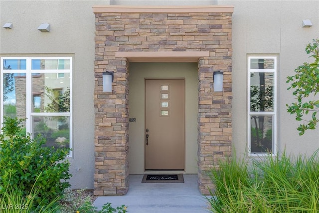 11280 Granite Ridge Dr Unit 1009, Las Vegas, NV 89135 - view of exterior entry featuring stucco siding and stone siding