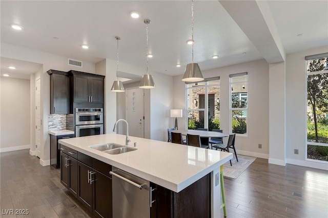 11280 Granite Ridge Dr Unit 1009, Las Vegas, NV 89135 - kitchen with stainless steel appliances, a sink, baseboards, healthy amount of natural light, and recessed lighting