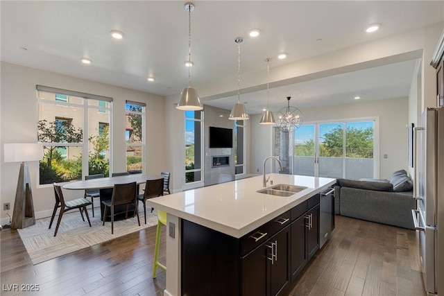 11280 Granite Ridge Dr Unit 1009, Las Vegas, NV 89135 - kitchen with a sink, open floor plan, appliances with stainless steel finishes, dark wood-style floors, and recessed lighting