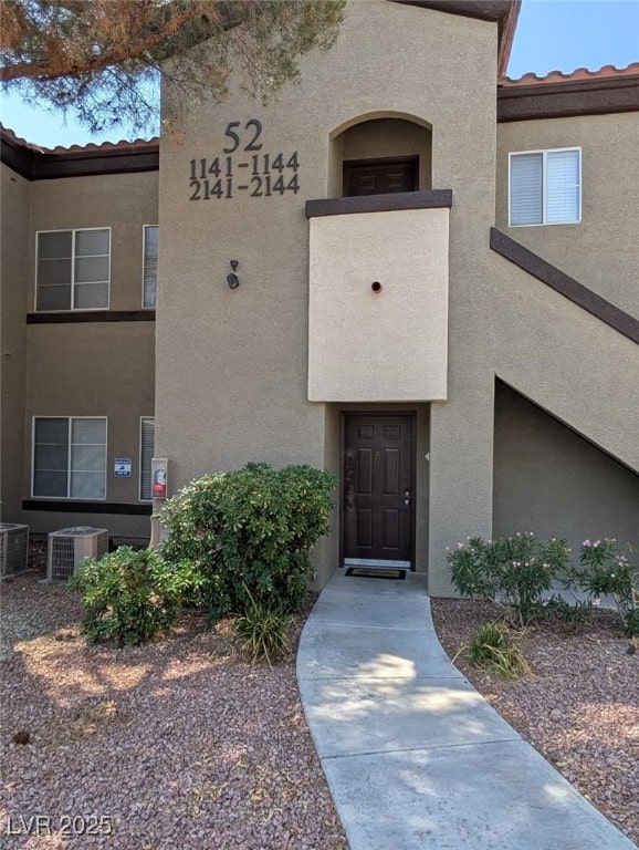 9000 Las Vegas Blvd Unit 1142, Las Vegas, NV 89123 - property entrance with stucco siding and a tiled roof