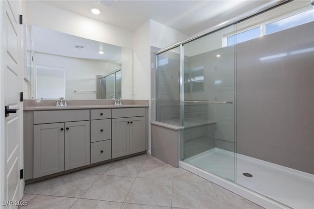 9086 Nostrand Ave, Las Vegas, NV 89148 - bathroom featuring tile patterned flooring, double vanity, a shower stall, and recessed lighting