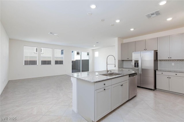 9086 Nostrand Ave, Las Vegas, NV 89148 - kitchen with a sink, appliances with stainless steel finishes, recessed lighting, light stone countertops, and decorative backsplash