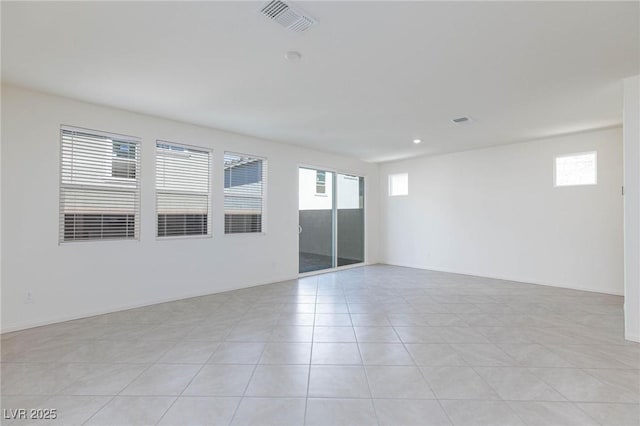 9086 Nostrand Ave, Las Vegas, NV 89148 - unfurnished room featuring plenty of natural light, light tile patterned floors, and recessed lighting