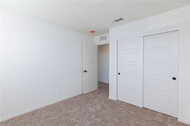 9086 Nostrand Ave, Las Vegas, NV 89148 - unfurnished bedroom featuring light carpet, baseboards, and a closet