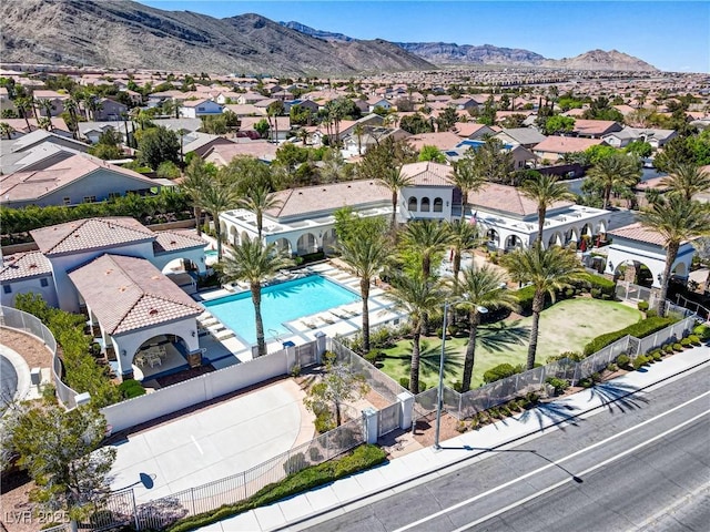 3205 Rainmaker St, Las Vegas, NV 89129 - aerial perspective of suburban area featuring a mountainous background and a pool