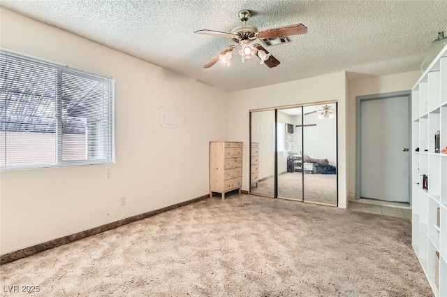 7898 Wishing Well Rd, Las Vegas, NV 89123 - unfurnished bedroom featuring light colored carpet, a closet, a textured ceiling, and ceiling fan