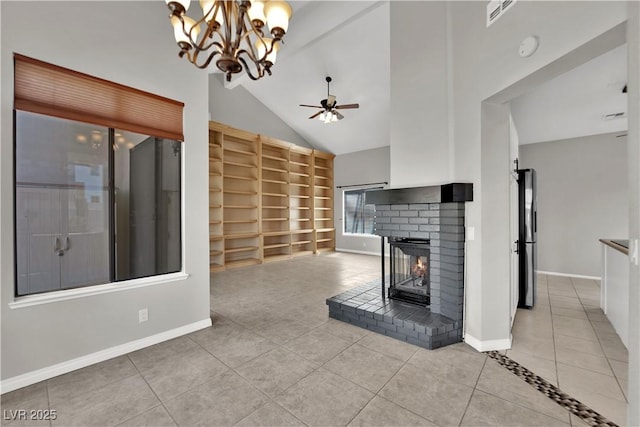 2714 Bridgepointe Dr, Las Vegas, NV 89121 - unfurnished living room with tile patterned flooring, built in shelves, a brick fireplace, ceiling fan, and baseboards