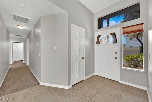 2714 Bridgepointe Dr, Las Vegas, NV 89121 - foyer featuring light tile patterned floors and baseboards