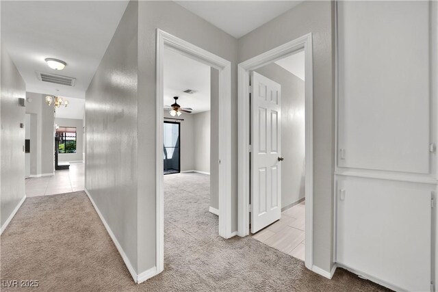 2714 Bridgepointe Dr, Las Vegas, NV 89121 - corridor with light carpet and baseboards
