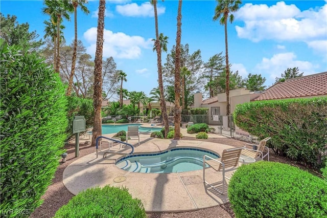 2714 Bridgepointe Dr, Las Vegas, NV 89121 - community pool featuring a hot tub and a patio