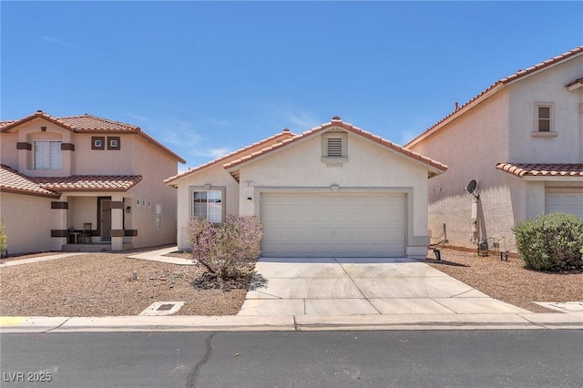 1011 Dancing Vines Ave, Las Vegas, NV 89183 - mediterranean / spanish-style home with driveway, a garage, stucco siding, and a tile roof