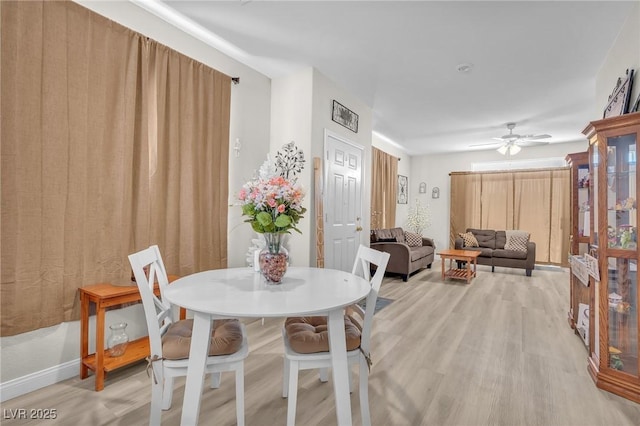 1011 Dancing Vines Ave, Las Vegas, NV 89183 - dining room featuring light wood-style flooring and a ceiling fan