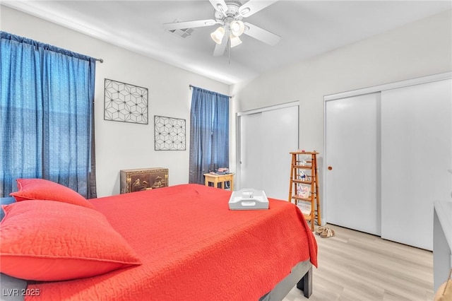 1011 Dancing Vines Ave, Las Vegas, NV 89183 - bedroom featuring multiple closets, light wood-style flooring, and ceiling fan