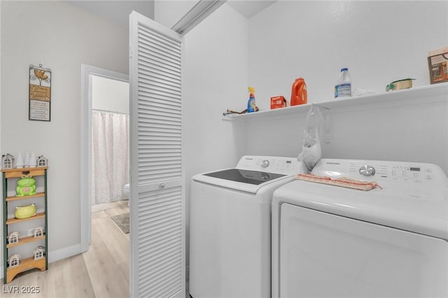 1011 Dancing Vines Ave, Las Vegas, NV 89183 - washroom with washer and clothes dryer and light wood-type flooring