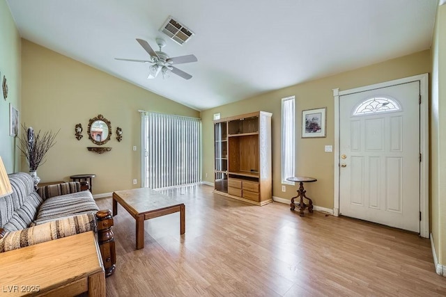 6766 Sebring St, Las Vegas, NV 89103 - living room featuring light wood-style floors, a ceiling fan, and vaulted ceiling