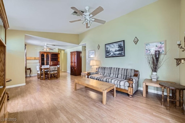 6766 Sebring St, Las Vegas, NV 89103 - living area with ceiling fan, light wood-style floors, and lofted ceiling