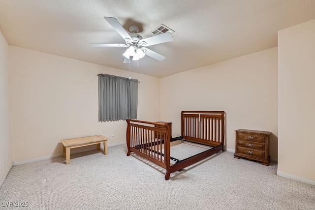 6766 Sebring St, Las Vegas, NV 89103 - carpeted bedroom with a ceiling fan and a nursery area