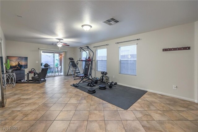 6546 American Flower St, Las Vegas, NV 89148 - workout room featuring light tile patterned flooring, ceiling fan, and baseboards