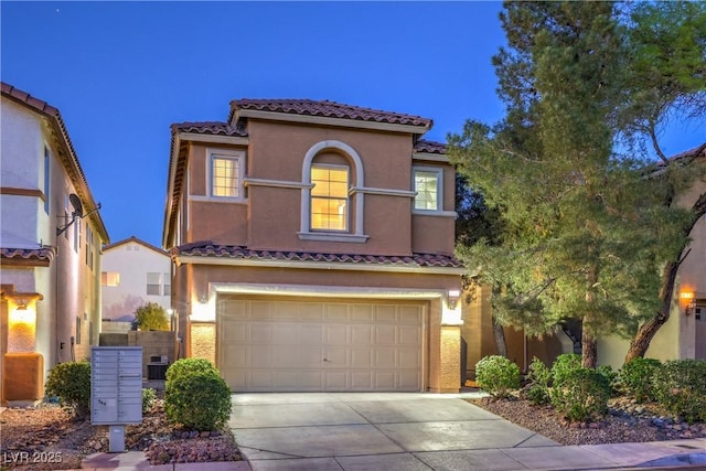 6546 American Flower St, Las Vegas, NV 89148 - mediterranean / spanish house with a tile roof, stucco siding, concrete driveway, and an attached garage