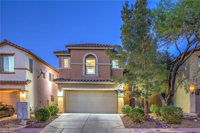 6546 American Flower St, Las Vegas, NV 89148 - mediterranean / spanish home with an attached garage, concrete driveway, stucco siding, and a tile roof