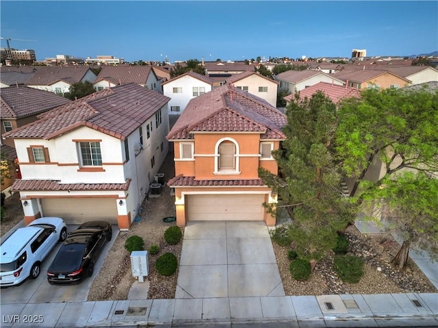 6546 American Flower St, Las Vegas, NV 89148 - view of front of home with a garage, a residential view, driveway, stucco siding, and central AC unit
