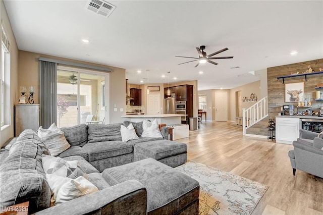 1425 Overseer Ave, Henderson, NV 89074 - living area featuring ceiling fan, stairway, plenty of natural light, light wood-style flooring, and recessed lighting