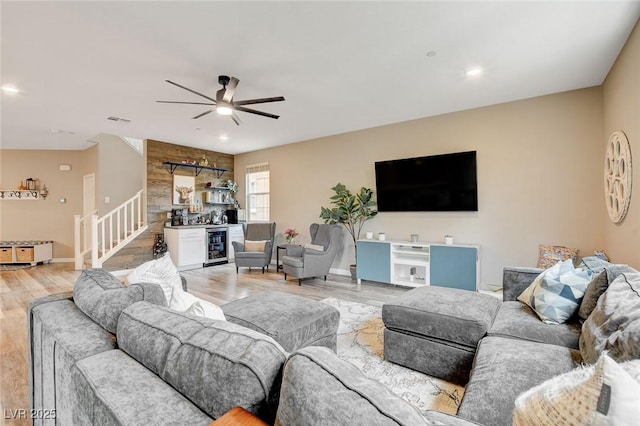 1425 Overseer Ave, Henderson, NV 89074 - living room featuring light wood finished floors, ceiling fan, a bar, wine cooler, and recessed lighting