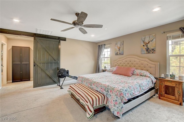 1425 Overseer Ave, Henderson, NV 89074 - bedroom with light carpet, a barn door, recessed lighting, ceiling fan, and baseboards