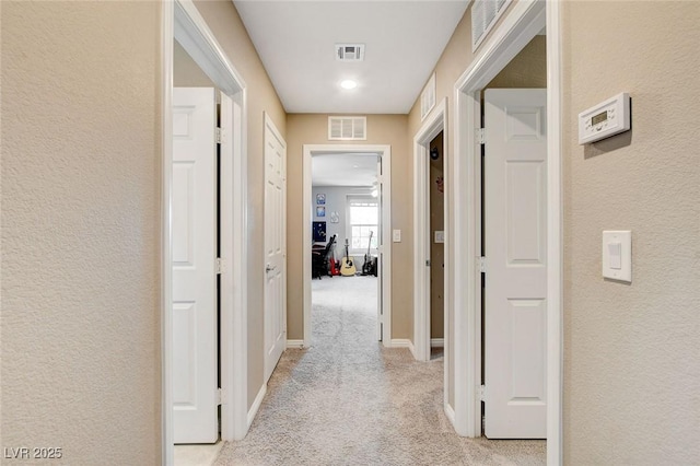 1425 Overseer Ave, Henderson, NV 89074 - hallway with light colored carpet, a textured wall, and baseboards