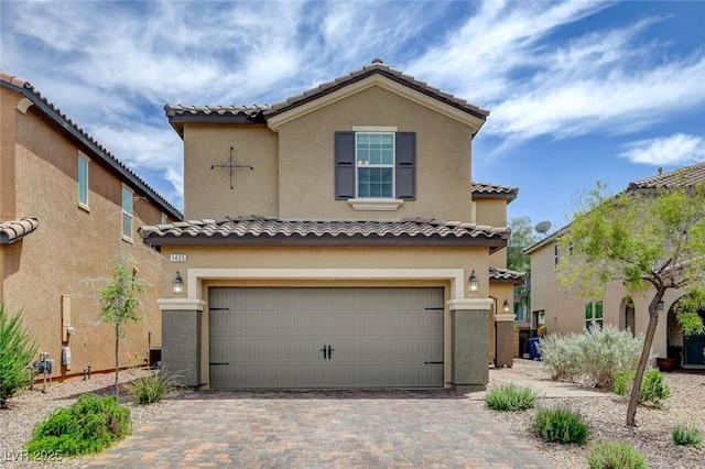 1425 Overseer Ave, Henderson, NV 89074 - mediterranean / spanish-style house with an attached garage, a tile roof, and stucco siding