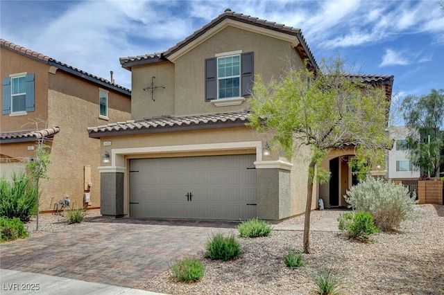 1425 Overseer Ave, Henderson, NV 89074 - view of front facade with an attached garage, stucco siding, a tile roof, and driveway