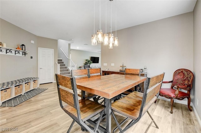 1425 Overseer Ave, Henderson, NV 89074 - dining area featuring light wood finished floors, stairs, and baseboards