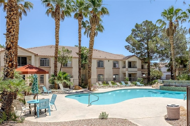 1830 N Buffalo Dr Unit 2024, Las Vegas, NV 89128 - community pool featuring a patio area