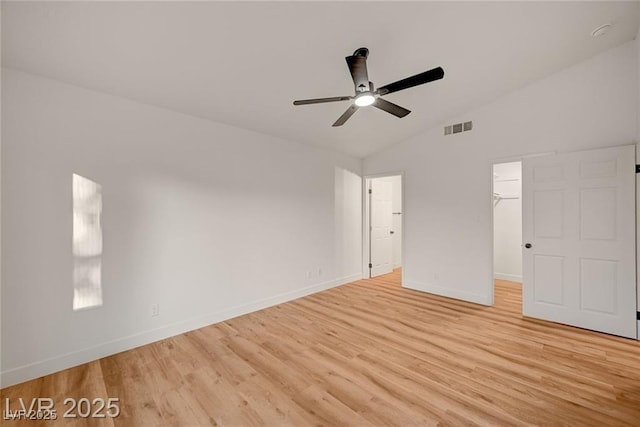 8412 Mulcahy Ave, Las Vegas, NV 89145 - unfurnished bedroom with vaulted ceiling, light wood-type flooring, baseboards, a spacious closet, and a ceiling fan