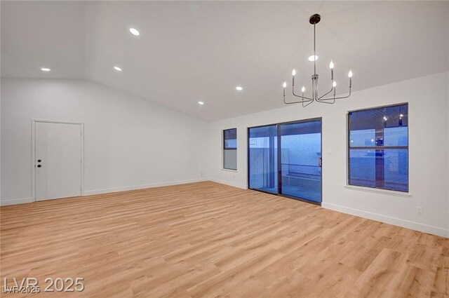 8412 Mulcahy Ave, Las Vegas, NV 89145 - empty room featuring lofted ceiling, light wood finished floors, a chandelier, baseboards, and recessed lighting