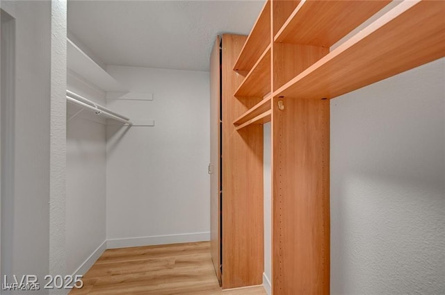 8412 Mulcahy Ave, Las Vegas, NV 89145 - walk in closet featuring wood finished floors
