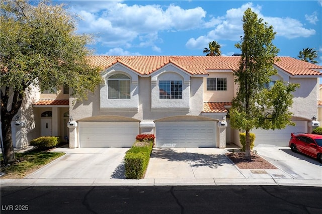 5256 Harvest Breeze Rd, Las Vegas, NV 89118 - mediterranean / spanish home with a tile roof, stucco siding, and concrete driveway