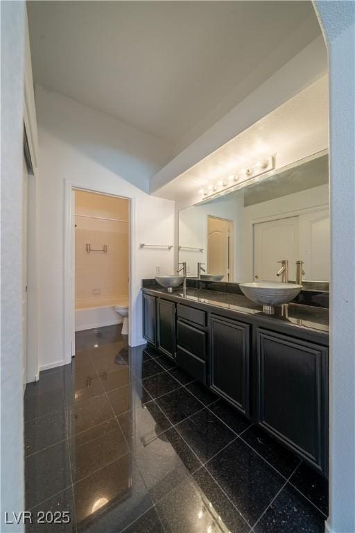 5256 Harvest Breeze Rd, Las Vegas, NV 89118 - full bathroom featuring double vanity, toilet, granite tiled floors, and baseboards