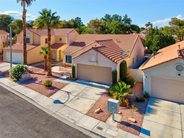9116 Cypress Point Way, Las Vegas, NV 89117 - mediterranean / spanish-style house featuring concrete driveway, stucco siding, a tiled roof, and a garage