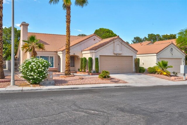 9116 Cypress Point Way, Las Vegas, NV 89117 - mediterranean / spanish home with a chimney, stucco siding, a garage, concrete driveway, and a tile roof