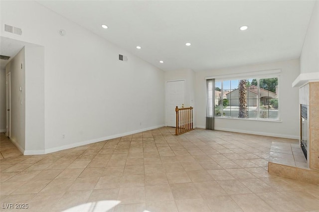 9116 Cypress Point Way, Las Vegas, NV 89117 - unfurnished living room with a tile fireplace, recessed lighting, light tile patterned floors, and baseboards