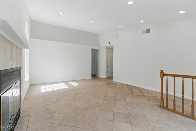 9116 Cypress Point Way, Las Vegas, NV 89117 - unfurnished living room featuring a tile fireplace, recessed lighting, light tile patterned floors, and baseboards